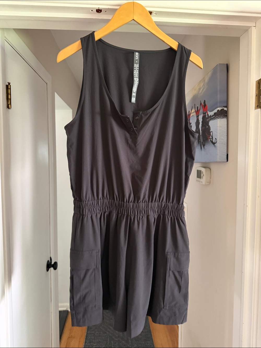 Vuori Black Sleeveless Romper with Elastic Waist and Pockets